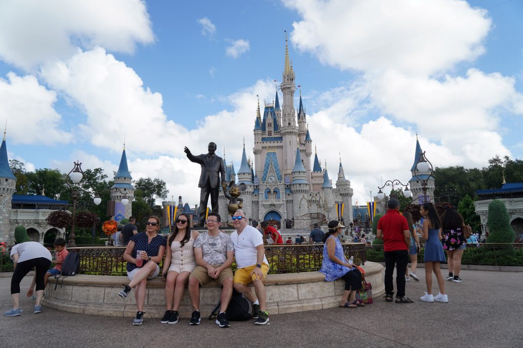 family in front of Cinderella Castle