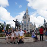 family in front of Cinderella Castle