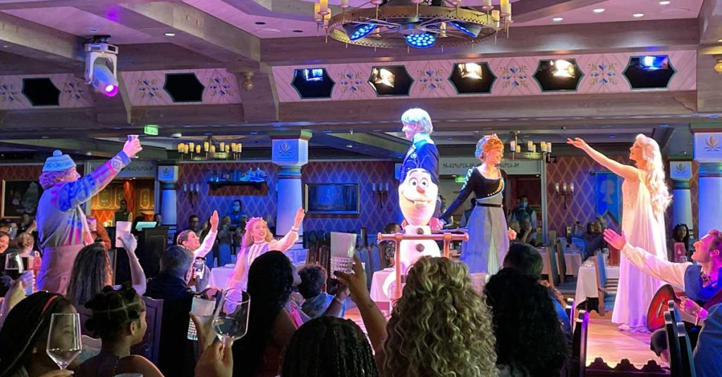 Oaken, Elsa, and Olaf lead a toast to celebrate Anna and Kristoff's engagement