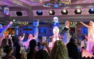 Oaken, Elsa, and Olaf lead a toast to celebrate Anna and Kristoff's engagement