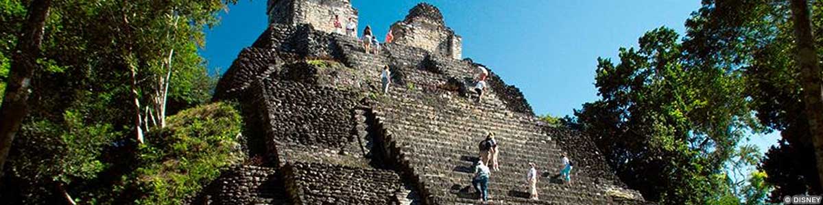 People climbing stairs at the Mayan Ruins