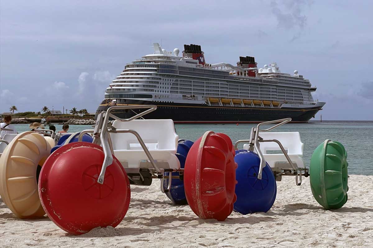 Best Disney Cruise Excursions in Bahamas, Caribbean, & Bermuda -- Water trikes in front of a Disney cruise ship