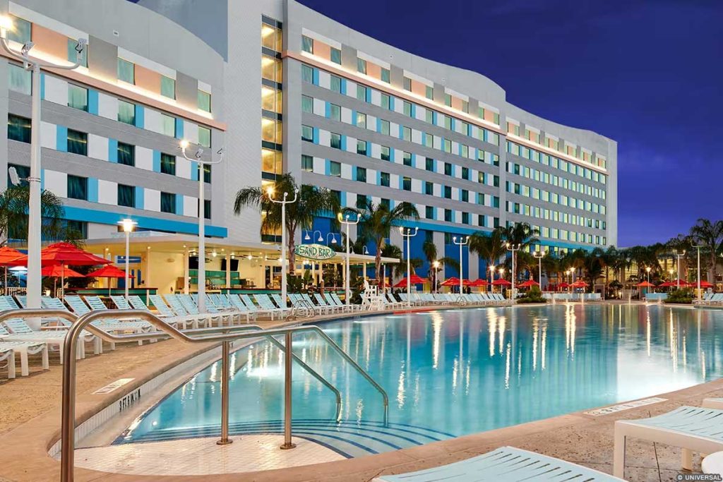 Exterior nighttime image of the pool at Universal's Endless Summer Resort