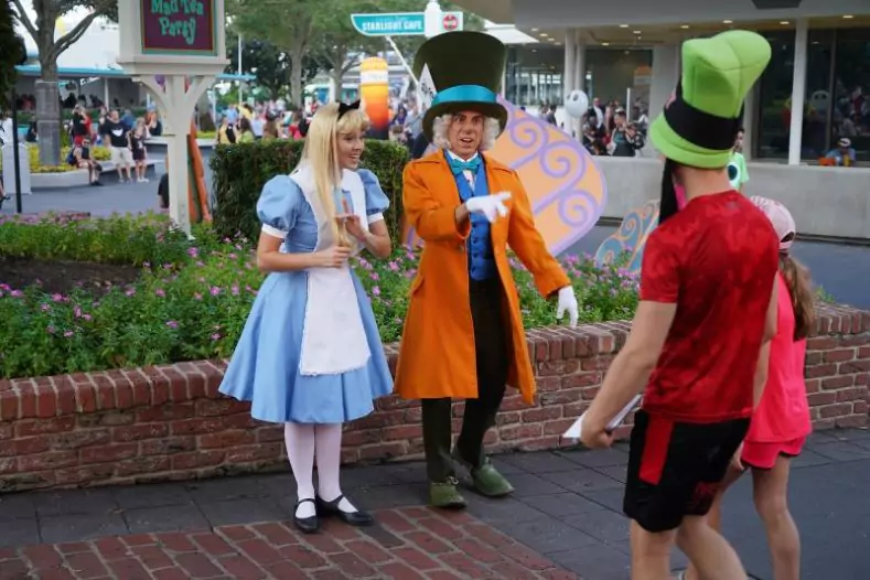 Alice and Mad Hatter meet Guests at Magic Kingdom