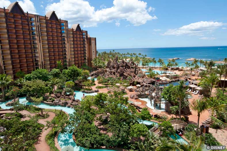 Aulani – Waikolohe Valley One of the towers of Disney's Aulani resort is seen in the background. The Waikolohe Valley water recreation area is shown in the foreground.