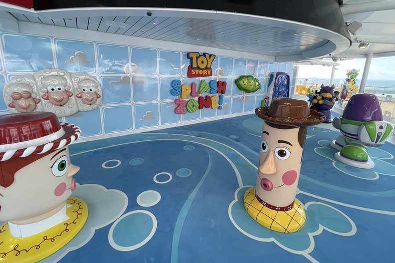 Stylized PIXAR characters spray water at the Toy Story Splash Zone on the Disney Wish