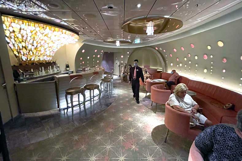 Disney Cruise - Pink Champagne Bar with bubble décor implying the inside of a champagne bottle