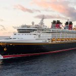 Disney Magic Cruise Ship: Complete Guide The Disney Magic cruise ship sails along the open ocean with a vivid sky as a backdrop | Image © Disney