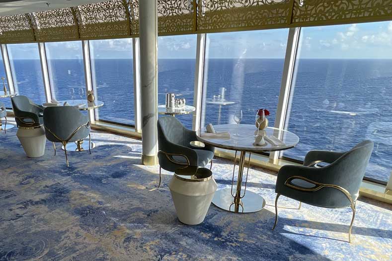 Food on Disney Cruise Line: Tables in front of large seaside windows
