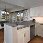 Image of the kitchen and dining area of a Disney Deluxe Villa
