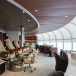 Pedicure chairs face large oceanview windows at Senses Spa on Disney Magic. Senses is offered on all Disney cruises.