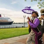 Disney Cruises from New Orleans - Members of a band in colorful attire march as a Disney Cruise Ship sails by in the background