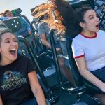 Close-up of two guests riding VelociCoaster, one of the best rides at Islands of Adventure