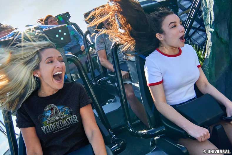 Close-up of two guests riding VelociCoaster, one of the best rides at Islands of Adventure