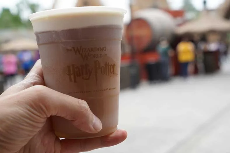 A plastic cup of Butterbeer