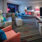 A vibrantly-colored living room in a King Suite at Hard Rock Hotel