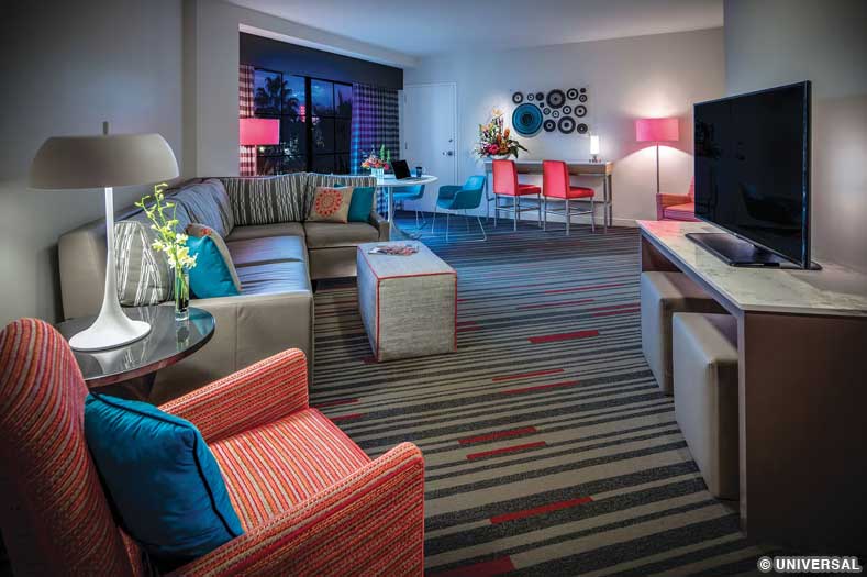 A vibrantly-colored living room in a King Suite at Hard Rock Hotel