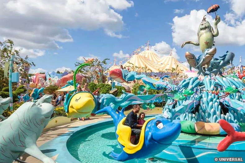 Guests ride in fish-shaped vehicles, circling around a central hub