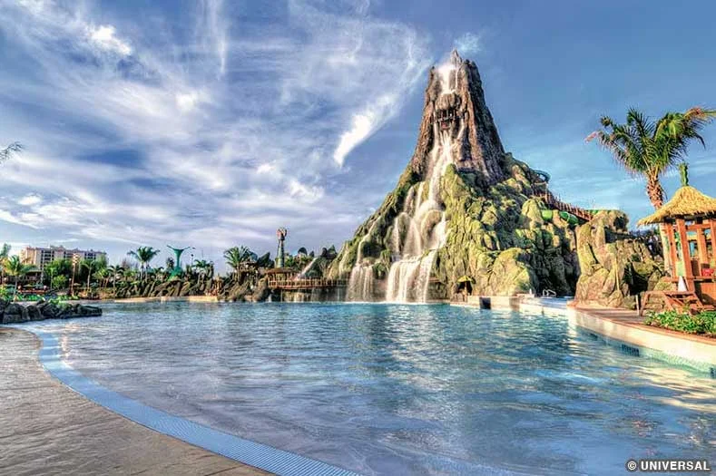 The large volcano icon of Volcano Bay water park, with waterfall and a large pool