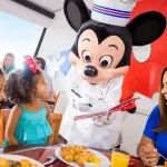 Disney World Free Dining Plans: Chef Mickey Mouse greets guests at a restaurant