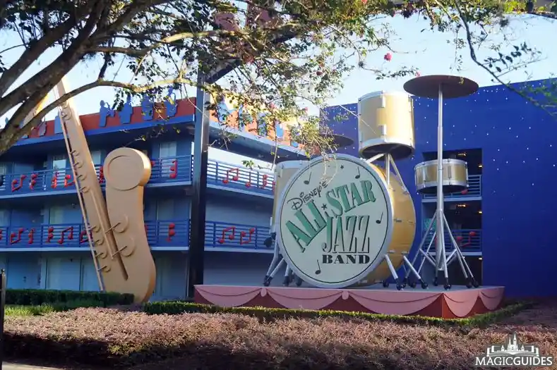 A giant drum set and saxophone on the exterior of a building at All Star Music resort