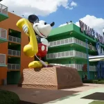 A Disney World Value resort hotel courtyard, with giant Mickey Mouse Telephone and Foosball courtyard