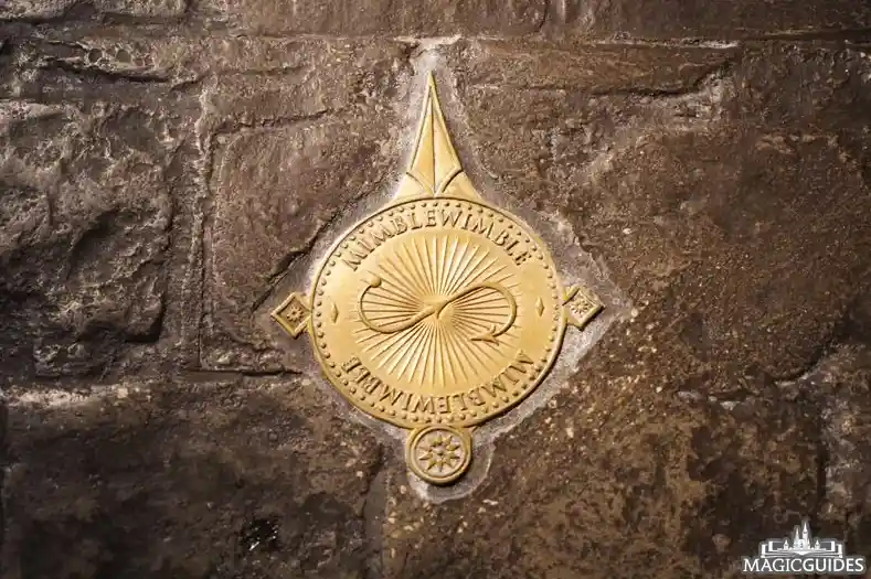 An emblem embedded in the ground, showing the wand movements necessary to activate special effects
