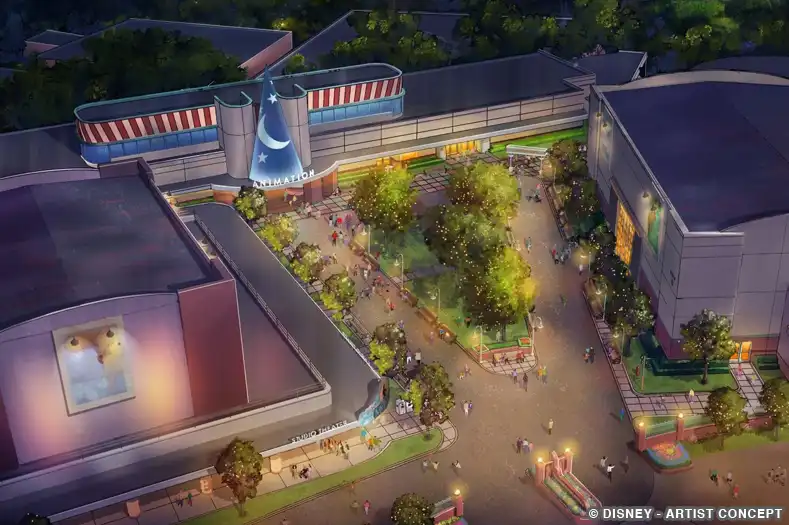 Concept art of an aerial view of the Walt Disney Studios area of Hollywood Studio. Trees overhand a relaxing courtyard surrounded by studio buildings and soundstages