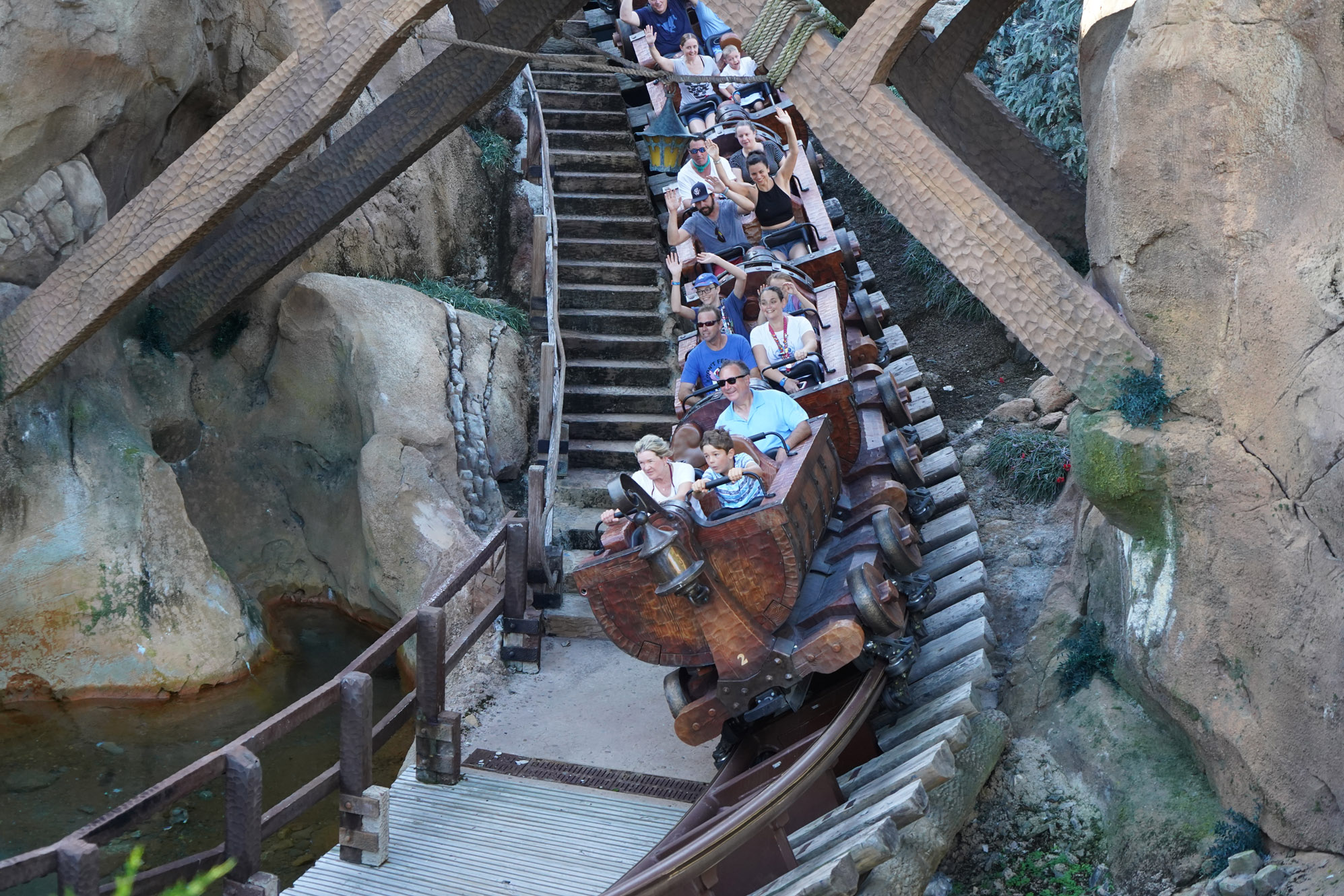 A mine car (roller coaster) careens down a track