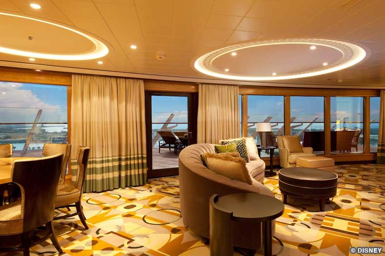 An expansive suite living room and dining room with wraparound floor-to-ceiling windows