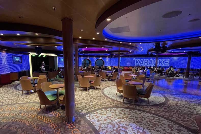 A large lounge area with a stage, and the word