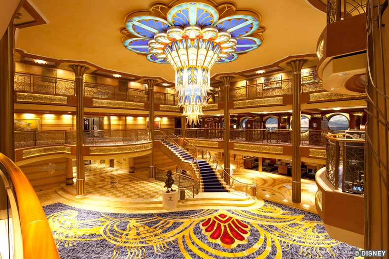 Disney Dream Atrium Lobby An elegant light fixture forms the centerpiece of the three-deck Disney Dream atrium lobby