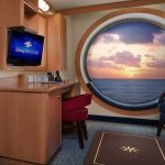 Deluxe Staterooms vs Deluxe Family Staterooms A large porthole window with padded seating