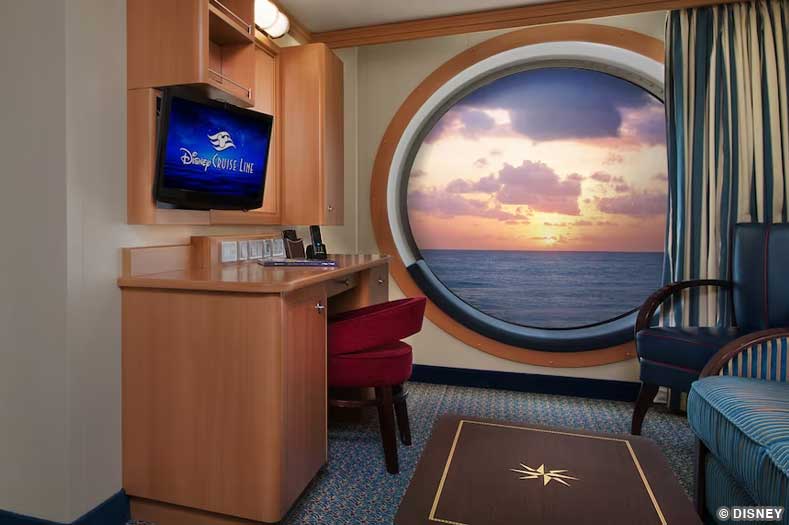 A large porthole window with padded seating