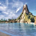 The large volcano icon of Volcano Bay water park, with waterfall and a large pool