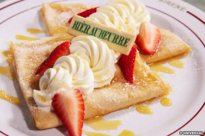 Butterbeer crepe with shortbread cookie butter, Bavarian cream, Butterbeer cream, strawberries, Butterbeer drizzle, and a Butterbeer shortbread cookie