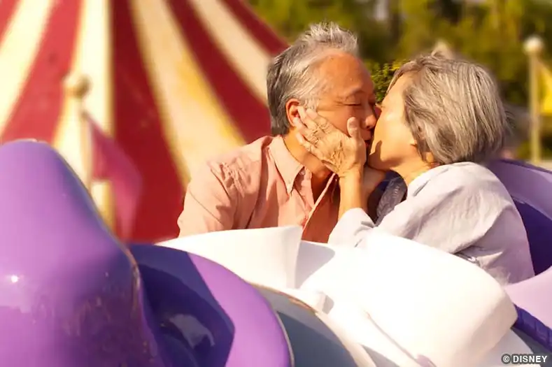 older couple kissing at disney world