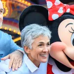 Seniors at Disney World pose with Minnie Mouse